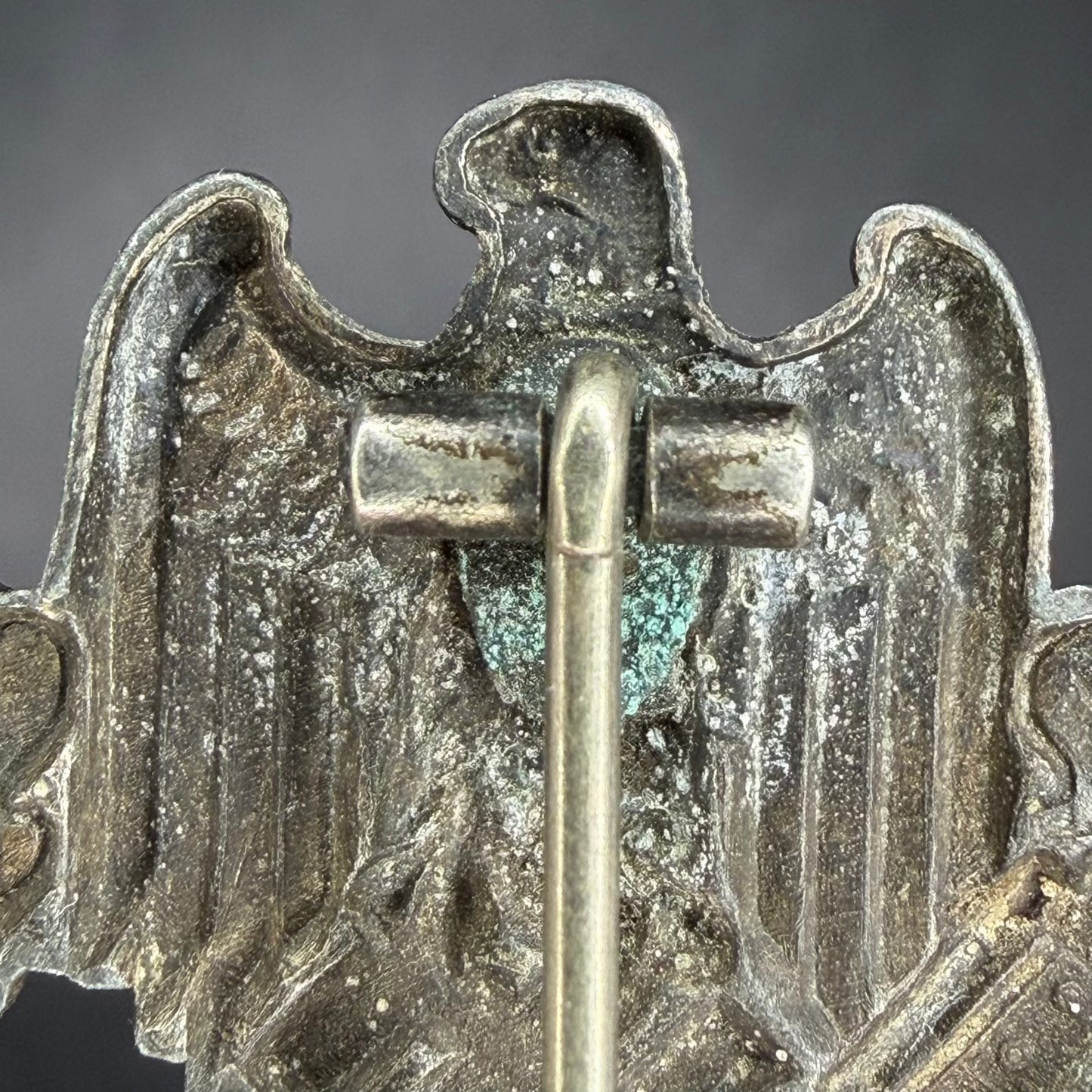 Reverse top section showing hinge and natural zinc oxidation