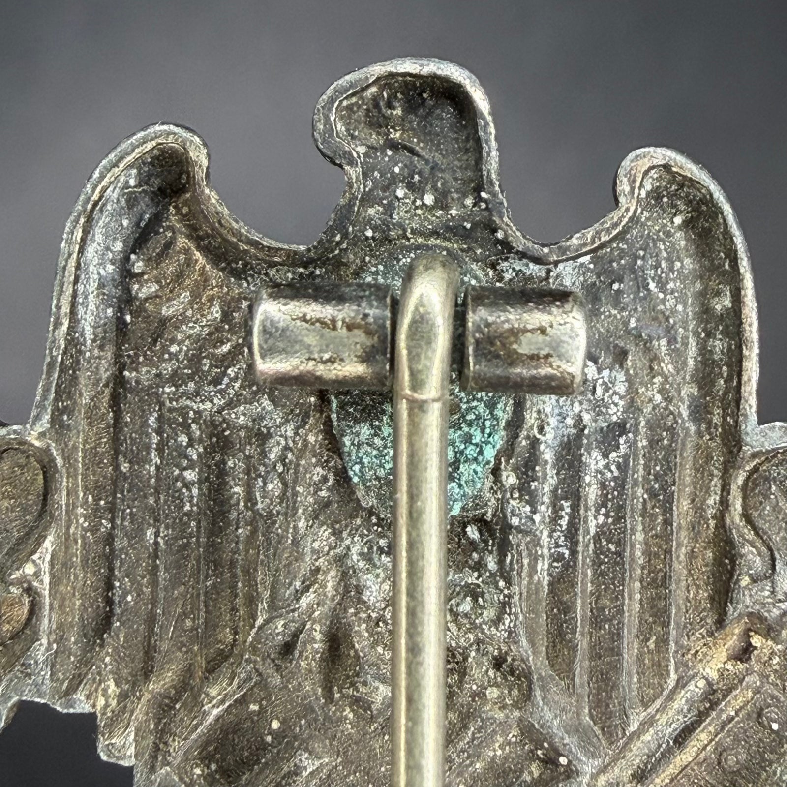 Reverse top section showing hinge and natural zinc oxidation