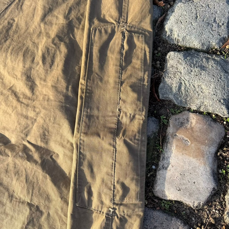 Original reinforcement patch on WW2 German Zeltbahn for tent button connection