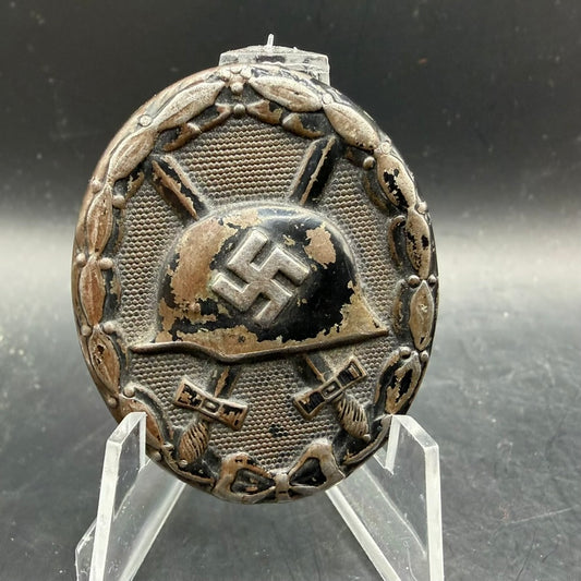 WWII German Wound Badge in Black made of zinc with very low rim and worn black finish