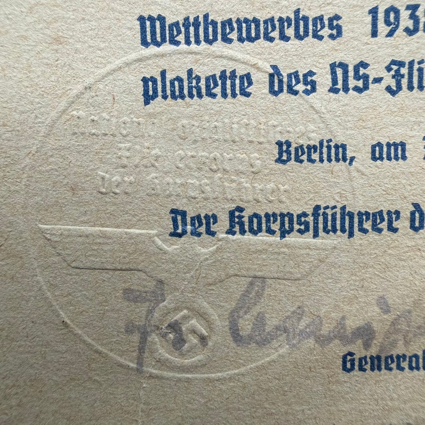 Close-up of NSFK embossed eagle seal and Generalleutnant signature on 1938 certificate