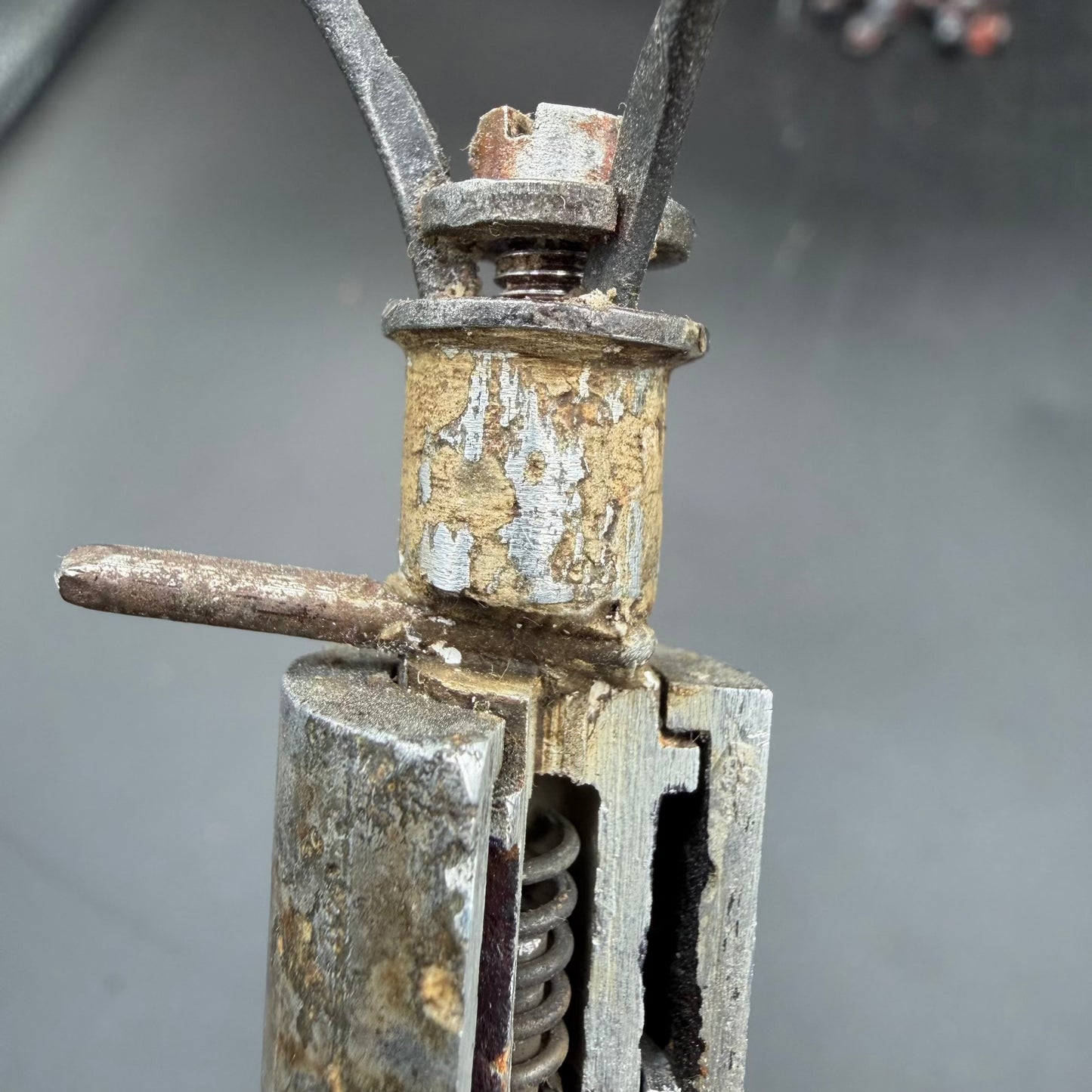 Close-up of igniter housing and spring mechanism inside WWII S-mine cutaway