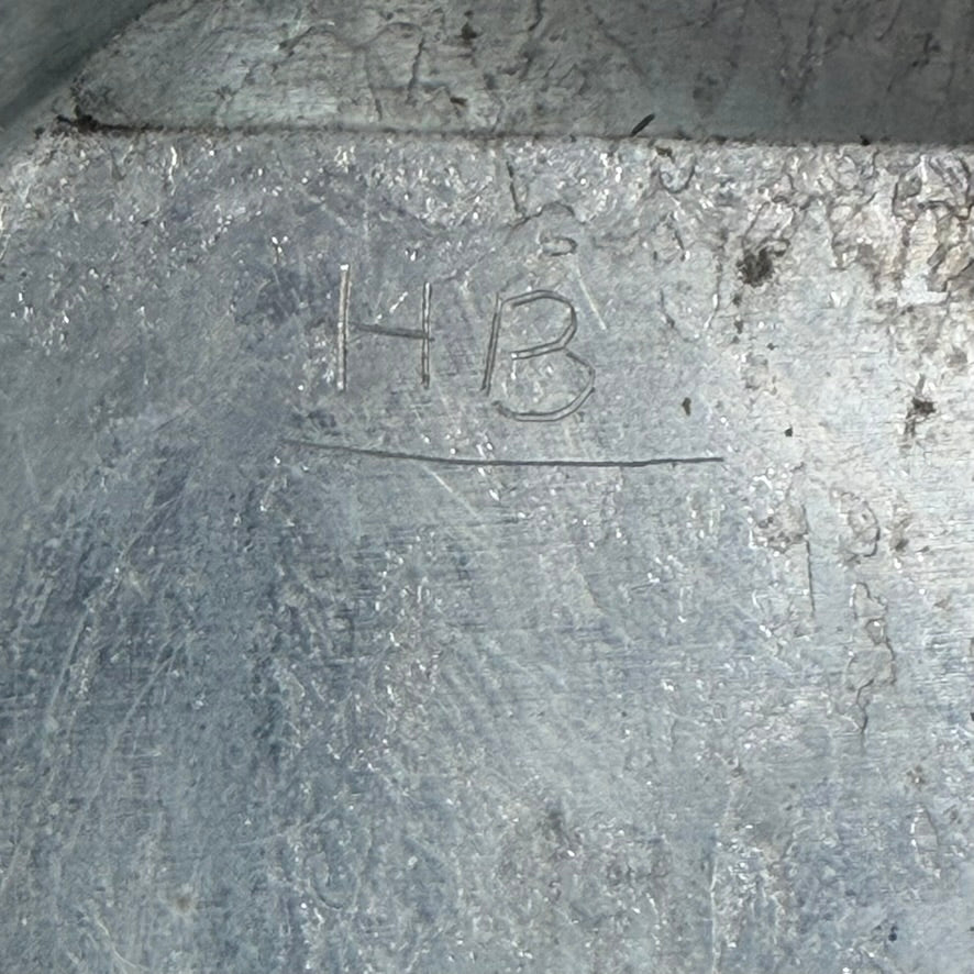 Detail of original metal clock housing with period wear