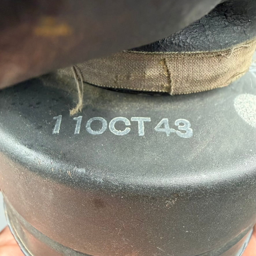 Close-up of British gas mask filter dated 11 OCT 43