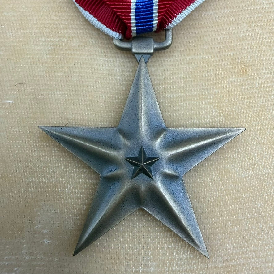 Open WWII Bronze Star Medal presentation case with medal inside