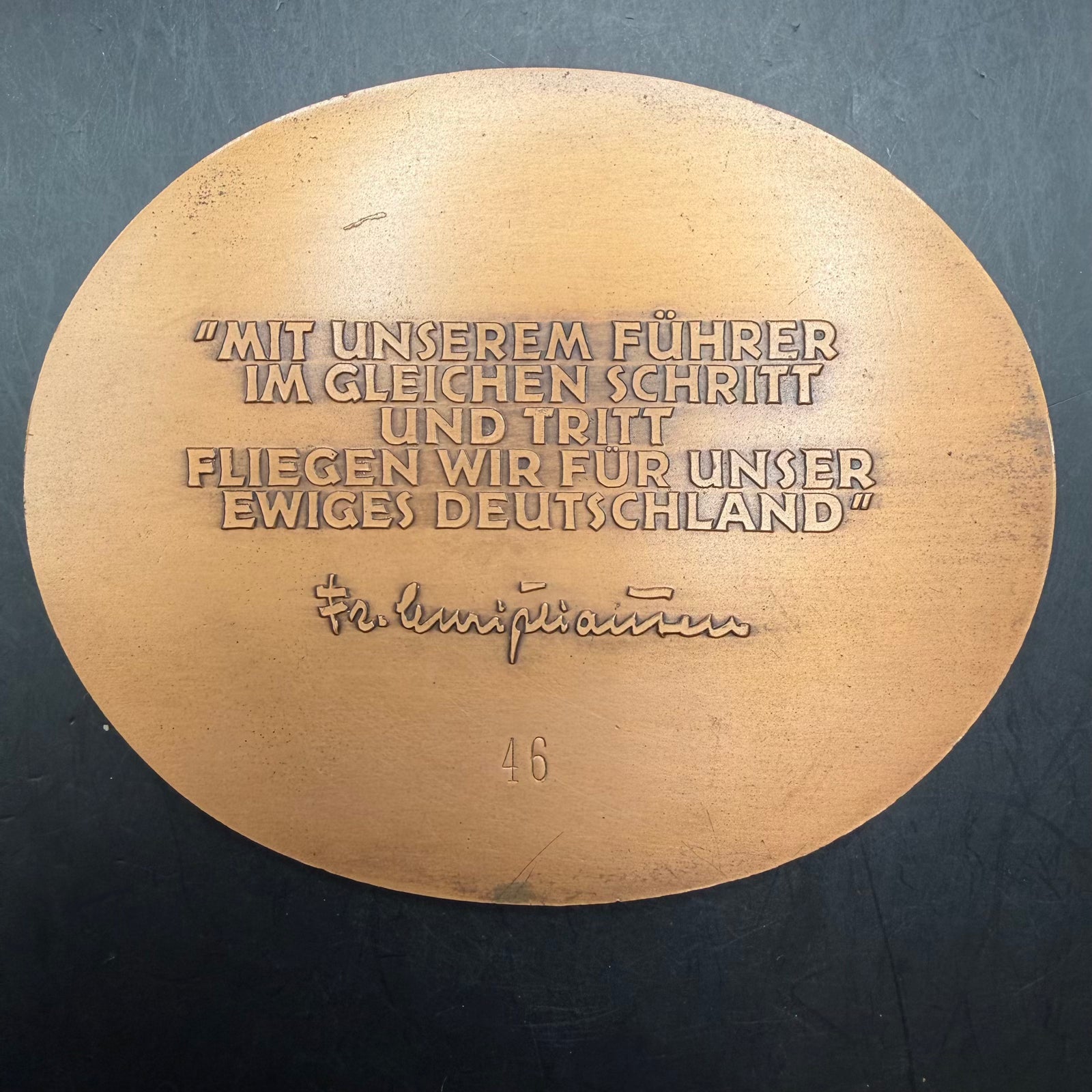 Reverse of NSFK medal with dedication text and signature relief