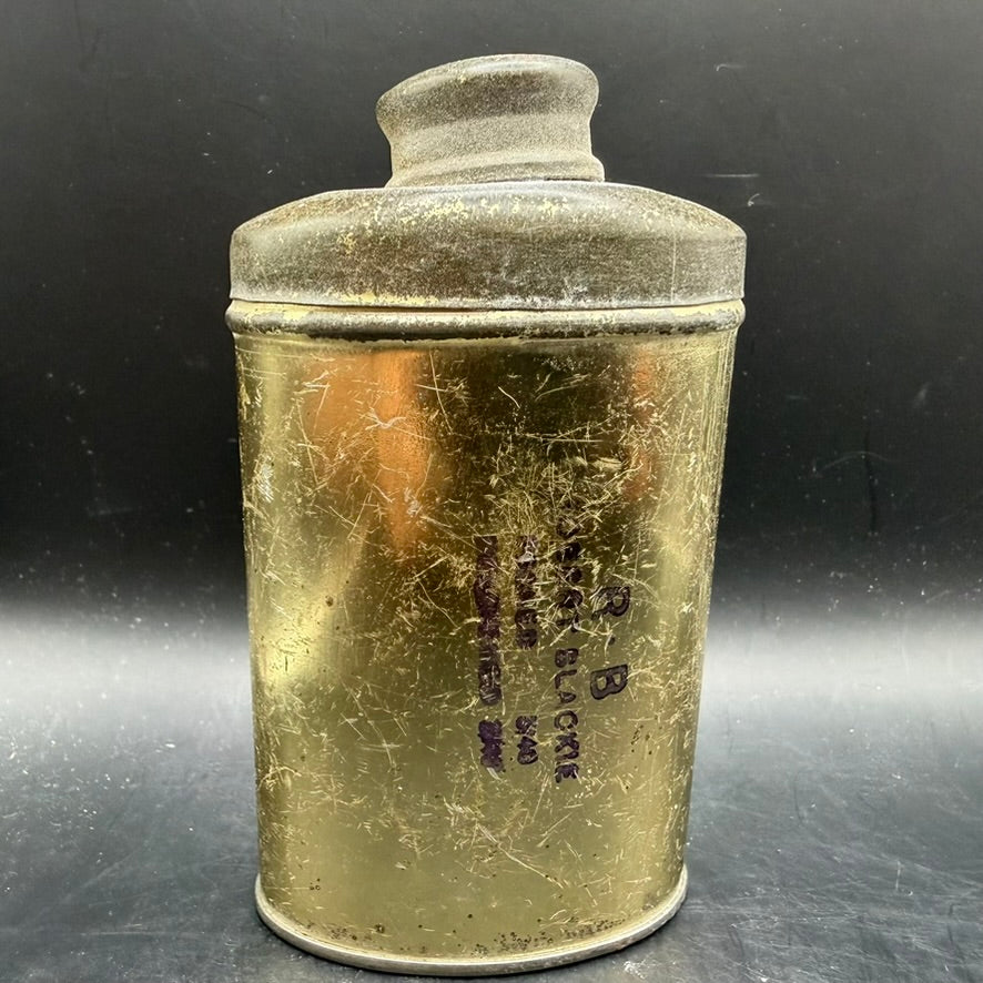 Rear view of British WWII foot powder tin showing wartime patina