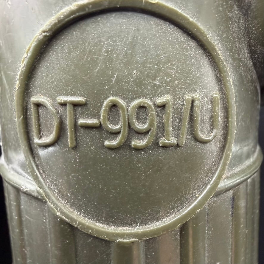 Close-up of DT-991/U marking on U.S. Navy flashlight