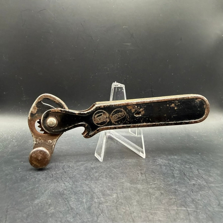 Reverse side of German adjustable can opener showing handle and cutting mechanism