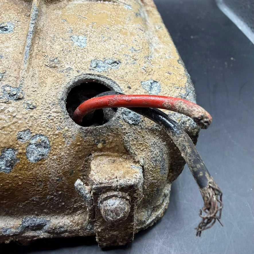Original wiring exit on WWII German Notek vehicle light